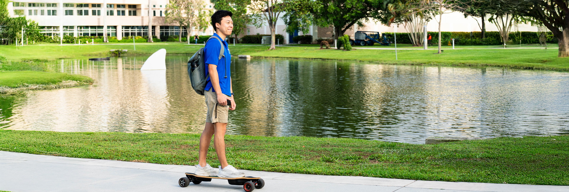 Student on skateboard around campus