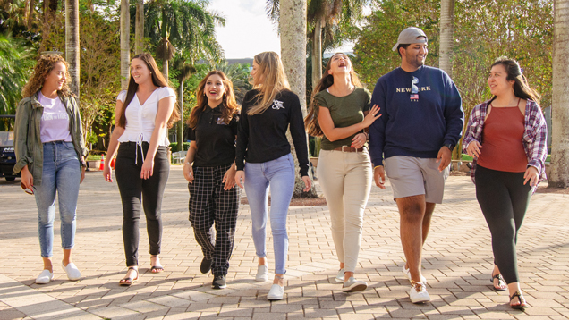 NSU graduates smile and pose for a picture