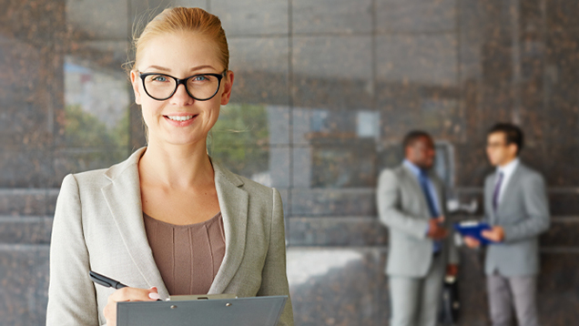 Group of business people standing outside of an office building