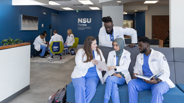 Group of students sitting at Denver campus lobby