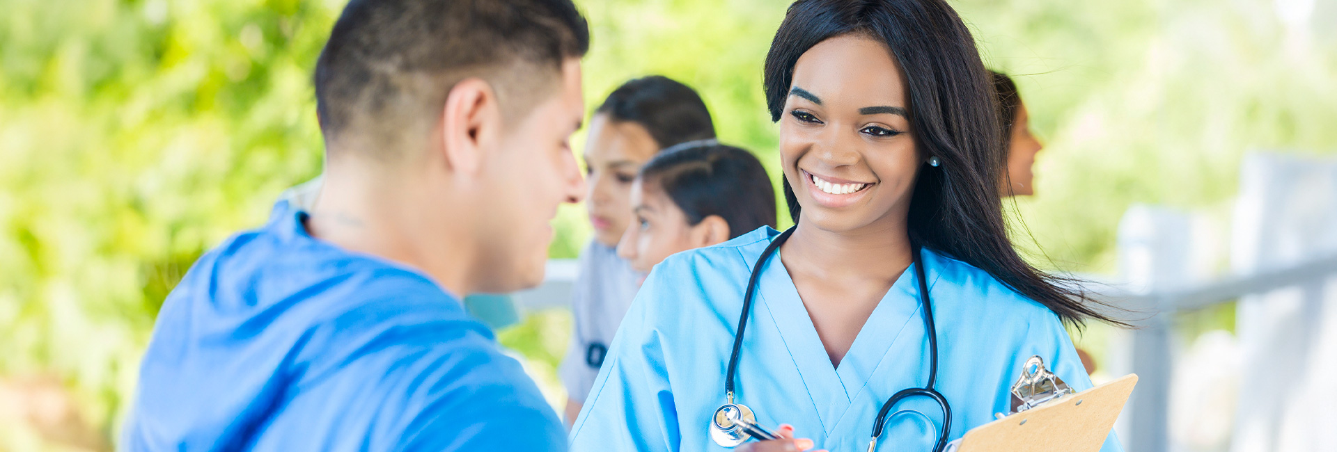 Nurse speaking to her patient at a community event
