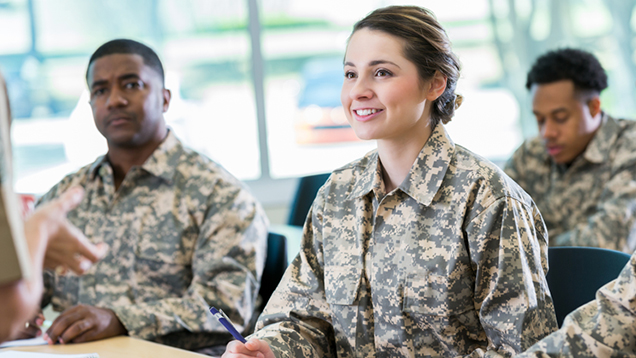 Group of veterans listening to a professor during class