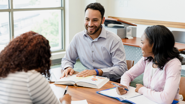 Teacher speaking to his students