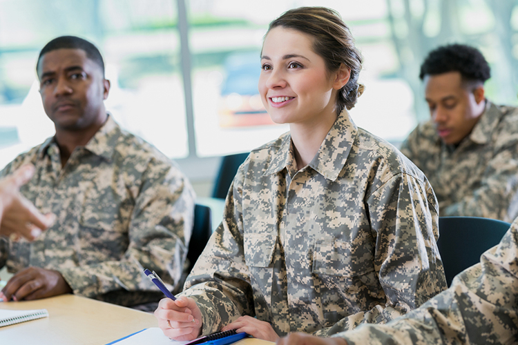 Group of veterans listening to a professor during class