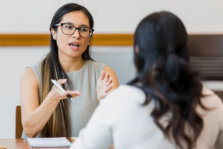 Student speaking to her adviser