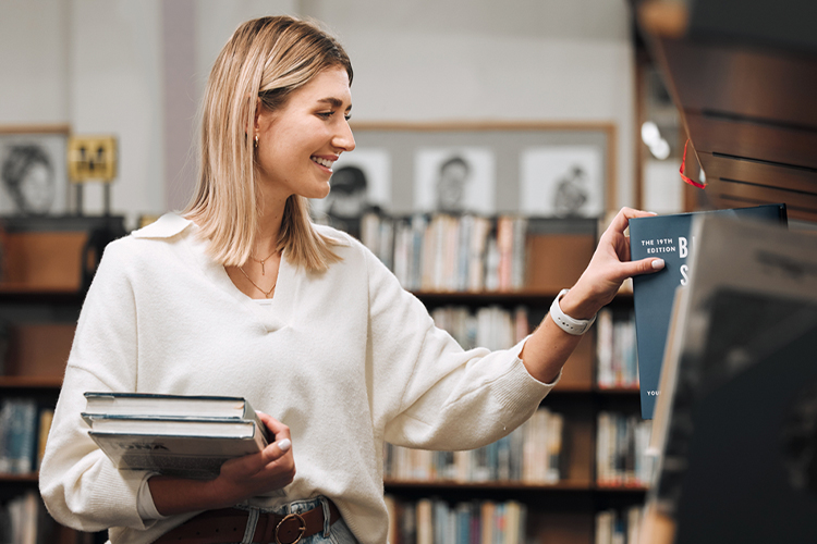Woman looking for books at the store