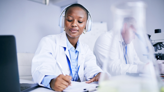 Student listening to research podcasts