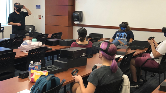 Instructor in class teaching virtual reality to students