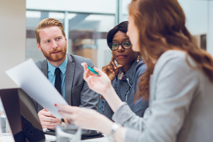 Group of people talking during a meeting