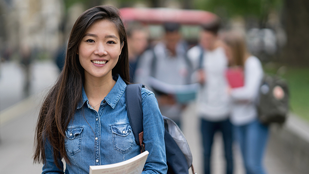 Student smiling at the camera