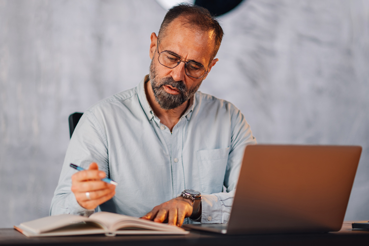 Professor working on syllabus