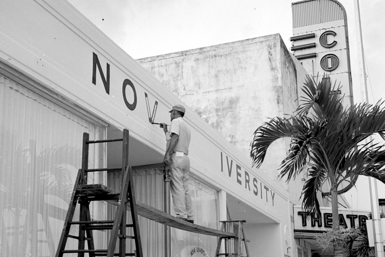 Painter working on NSU sign by hand historic photo
