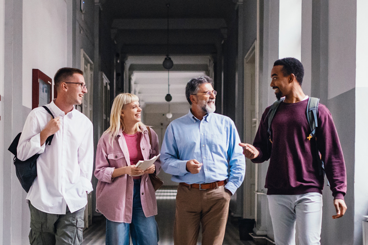 Faculty speaking and walking