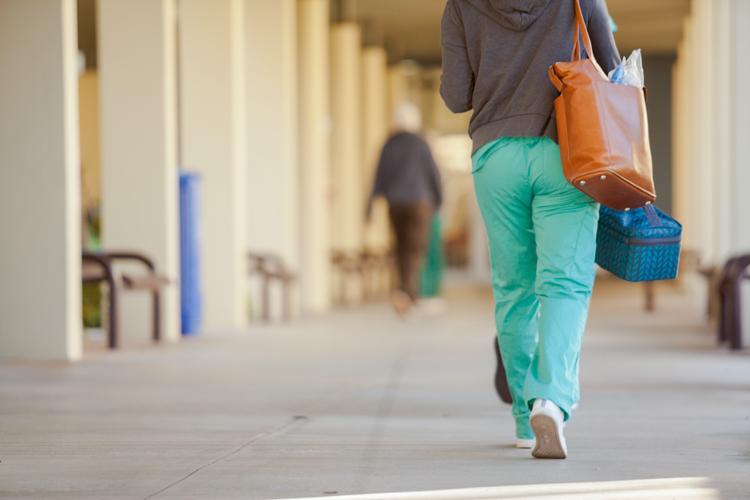 On campus hallway NSU student walking closeup