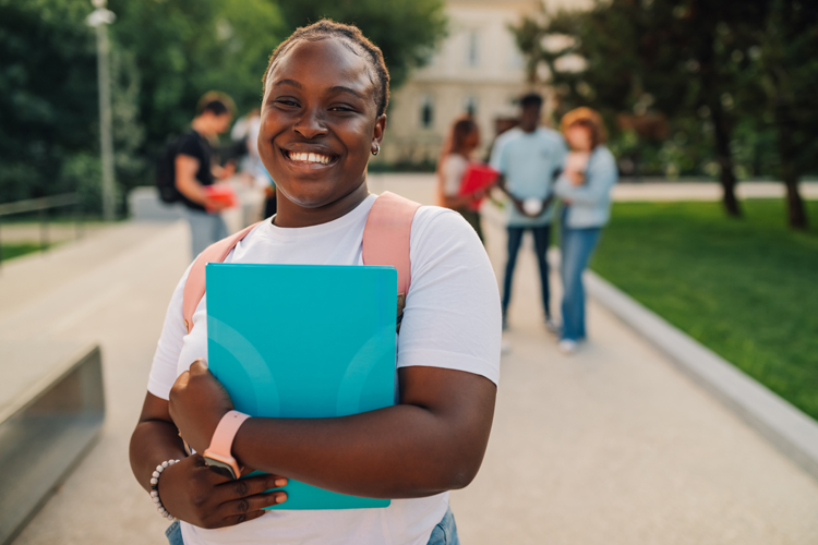 Student holding certificate