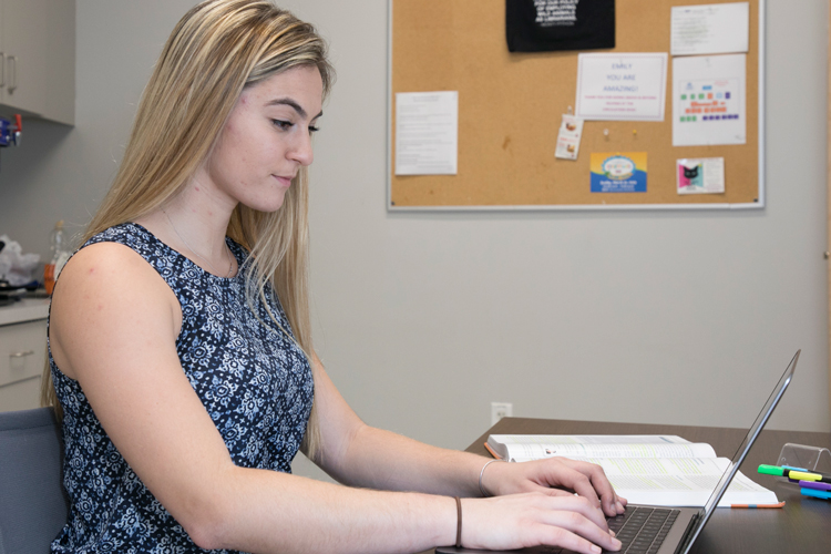 Student looking at grades on computer