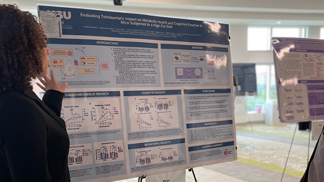 student researcher with her presentation