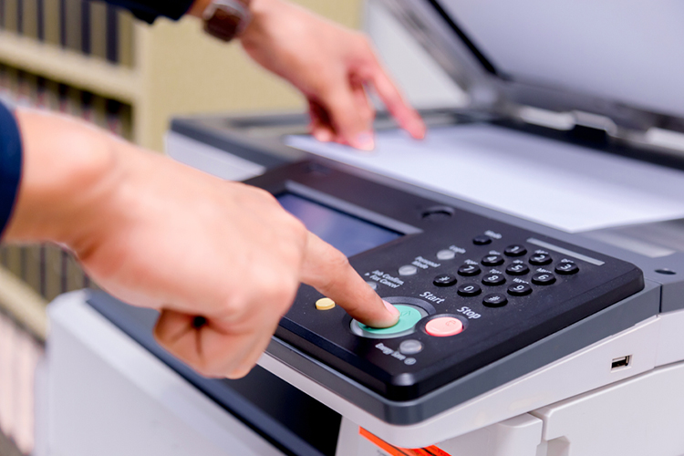 Man using a printer close up