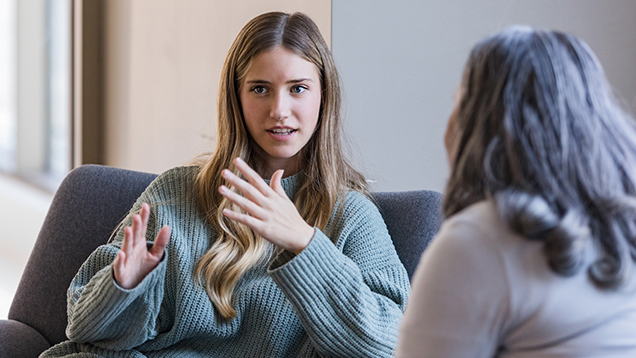 Student talking to her counselor