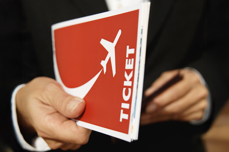 Person holding boarding ticket