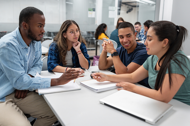 Group of students studying together in the classroom