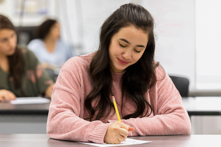 Student taking a test in class