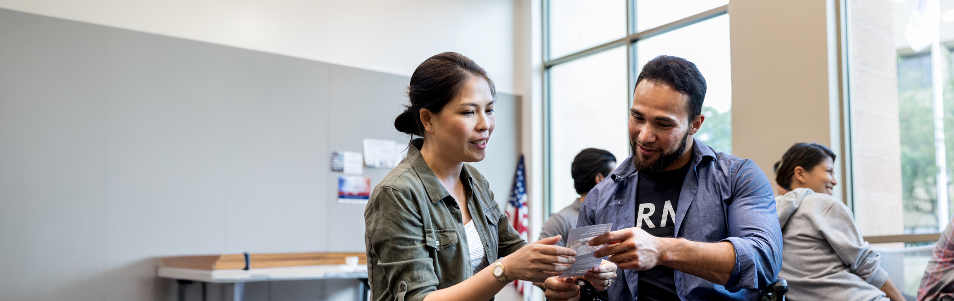Man and woman looking at a paper